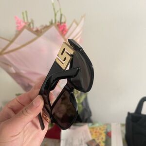 Stylish Black Sunglasses with Gold Accent